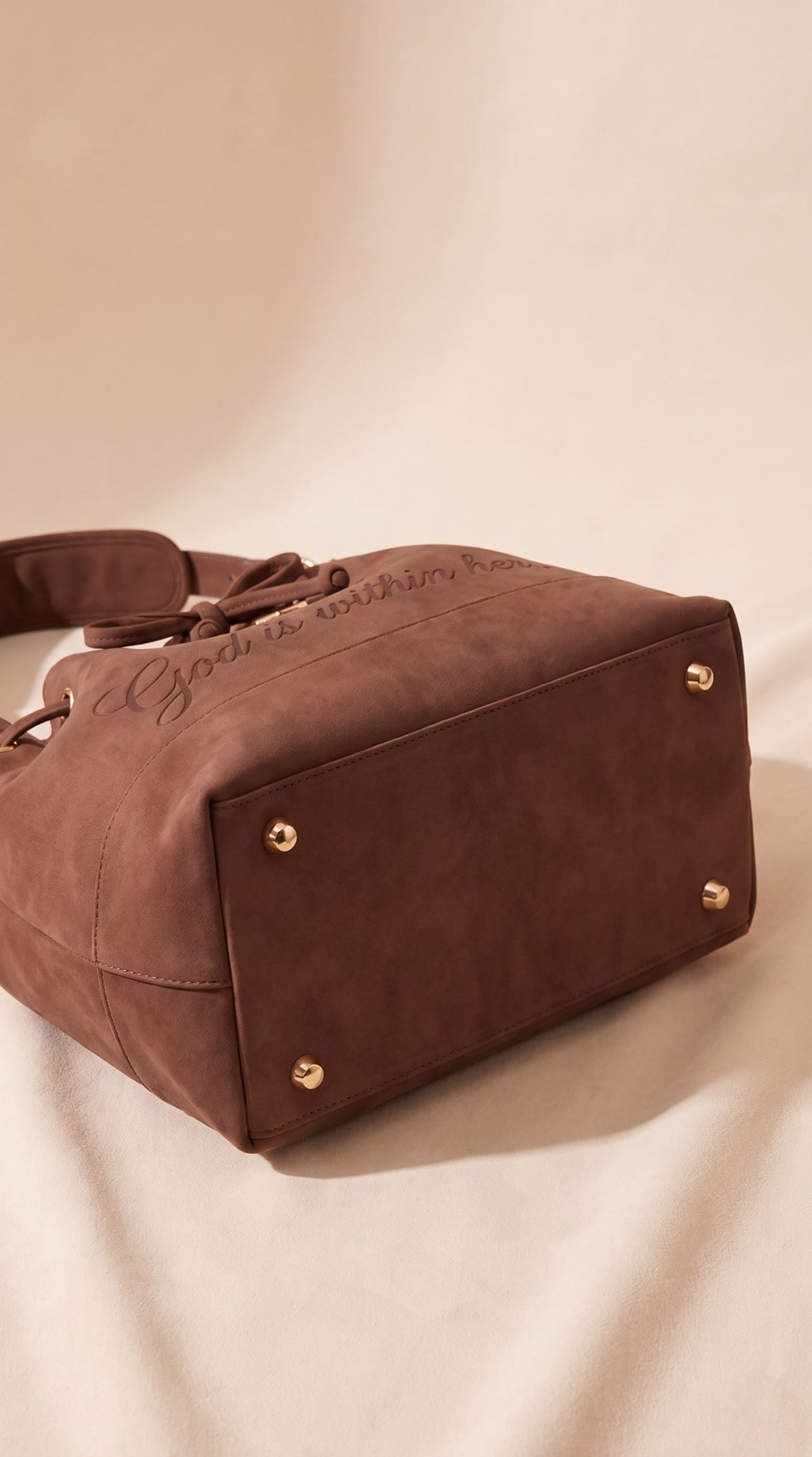 Metal feet protecting the base of the brown 46:5 Bag