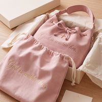 The 46:5 Bag unboxed with its blush dust bag, gift box and verse card