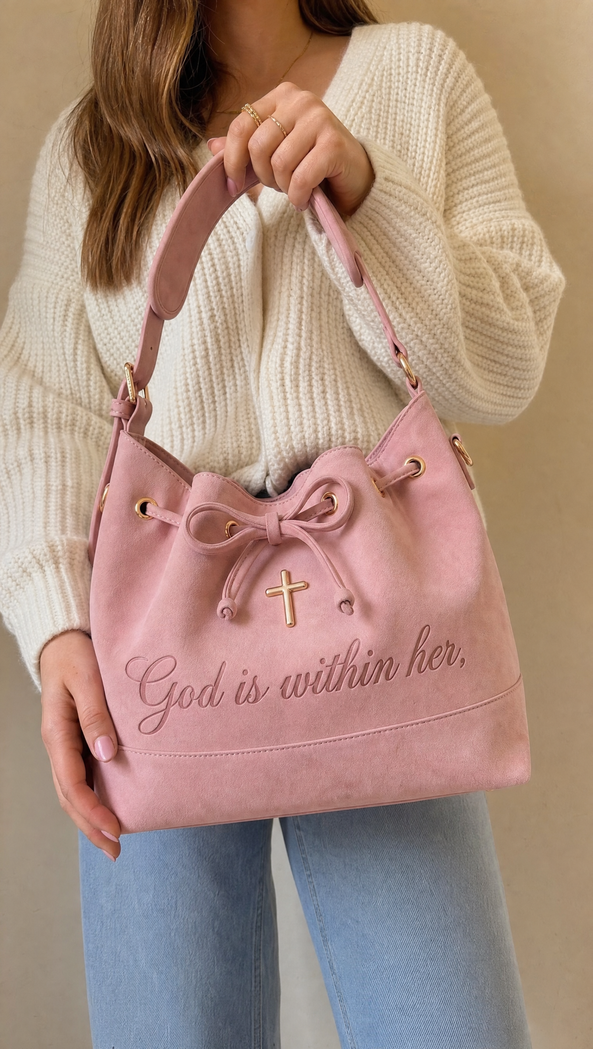 Holding the pink 46:5 Bag by its padded strap